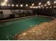 Swimming pool and patio area with brick pavers and string lights for relaxing evenings at 680 Cheoy Lee Cir, Winter Springs, FL 32708