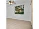 A bright bedroom featuring a barn door, large window, and modern ceiling fan at 710 Siena Palm Dr # 104, Celebration, FL 34747