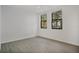 This bedroom has a ceiling fan and two windows that let in plenty of natural light at 710 Siena Palm Dr # 104, Celebration, FL 34747
