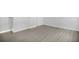 The bedroom features light wood-look floors, white walls, and white trim for a bright and airy feel at 710 Siena Palm Dr # 104, Celebration, FL 34747