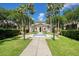 Community center featuring a serene fountain and lush landscaping at 710 Siena Palm Dr # 104, Celebration, FL 34747