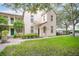Exterior of a two-story home with green lawn and partial landscape at 710 Siena Palm Dr # 104, Celebration, FL 34747