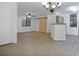 An open floor plan living room with a barn door and natural light at 710 Siena Palm Dr # 104, Celebration, FL 34747