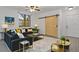 A beautifully staged living room featuring a black velvet sofa and a decorative rug at 710 Siena Palm Dr # 104, Celebration, FL 34747