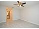 Spacious bedroom with tile floors leads to an en-suite bathroom for added privacy and comfort at 7104 Olympia Ct # 7104, Longwood, FL 32779