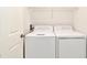 Convenient laundry room features a washer and dryer, providing ease and efficiency for daily chores at 7104 Olympia Ct # 7104, Longwood, FL 32779