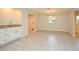 Open living room area featuring tile floors, neutral paint, wet bar and natural light at 7104 Olympia Ct # 7104, Longwood, FL 32779