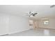 Well-lit living room featuring tile flooring, ceiling fan, wet bar and neutral paint at 7104 Olympia Ct # 7104, Longwood, FL 32779