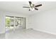Bright room featuring sliding doors to a covered patio, ceiling fan, and tile floor at 7104 Olympia Ct # 7104, Longwood, FL 32779