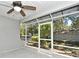 Screened-in porch with tiled flooring offers a relaxing outdoor space with views of the landscaped yard at 7104 Olympia Ct # 7104, Longwood, FL 32779