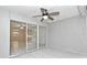 Enclosed porch with sliding glass doors and tile flooring leads into the home for seamless indoor-outdoor living at 7104 Olympia Ct # 7104, Longwood, FL 32779
