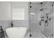Spa-like bathroom offers a modern soaking tub and frameless glass shower enclosure at 8713 Iron Mountain Trl, Windermere, FL 34786