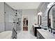 Luxurious bathroom with walk-in glass shower, soaking tub and dual vanity sinks at 8713 Iron Mountain Trl, Windermere, FL 34786