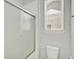Bathroom featuring a window, toilet, and glass-door shower at 8713 Iron Mountain Trl, Windermere, FL 34786
