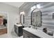 Stylish bathroom features dual sinks, modern fixtures, and a walk-in closet at 8713 Iron Mountain Trl, Windermere, FL 34786