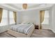 Inviting bedroom showcases a large window, cozy bed, and a neutral color palette at 8713 Iron Mountain Trl, Windermere, FL 34786