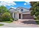 Charming home featuring a two-car garage and well-maintained landscaping at 8713 Iron Mountain Trl, Windermere, FL 34786