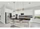 Bright kitchen with white cabinetry, stainless steel appliances, and a breakfast bar at 8713 Iron Mountain Trl, Windermere, FL 34786