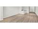 An open-concept living area with wood-look flooring and a bar-height counter, ideal for modern living at 8713 Iron Mountain Trl, Windermere, FL 34786