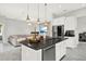 Open concept kitchen and living area with modern design at 8713 Iron Mountain Trl, Windermere, FL 34786
