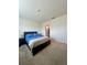 Comfortable bedroom with neutral tones, carpet, and natural light at 9033 Alba Ln, Kissimmee, FL 34747