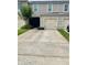 Charming two-story townhome with attached garage, landscaped yard and inviting entrance at 9033 Alba Ln, Kissimmee, FL 34747