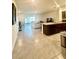 Open floor plan featuring a modern kitchen, dining area, and a spacious living room at 9033 Alba Ln, Kissimmee, FL 34747