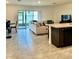 Open floor plan featuring a modern kitchen, dining area, and a spacious living room at 9033 Alba Ln, Kissimmee, FL 34747