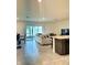 Open floor plan featuring a modern kitchen, dining area, and a spacious living room at 9033 Alba Ln, Kissimmee, FL 34747
