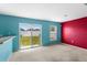 Bright room with sliding glass doors opening to the backyard at 1033 Sabine Pl, Kissimmee, FL 34759