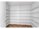 Walk-in pantry with multiple shelves for maximum storage space at 1033 Sabine Pl, Kissimmee, FL 34759