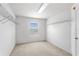 Walk-in closet featuring carpet, a window, and adjustable shelving at 1033 Sabine Pl, Kissimmee, FL 34759