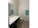 This bathroom features a tile floor, toilet, shower, sink, and large mirror at 113 San Mardeen Ct, Daytona Beach, FL 32117