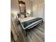 This bedroom features a mirror, double bed, wood floors, and closet with folding doors at 113 San Mardeen Ct, Daytona Beach, FL 32117