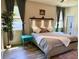 Bright bedroom featuring a comfortable bed, soft natural lighting, and stylish bedside table at 113 San Mardeen Ct, Daytona Beach, FL 32117