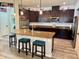 Modern kitchen with stainless steel appliances, granite countertops, and a breakfast bar at 113 San Mardeen Ct, Daytona Beach, FL 32117