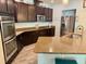 Bright kitchen featuring granite countertops, stainless steel appliances, and ample cabinet space at 113 San Mardeen Ct, Daytona Beach, FL 32117