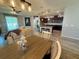 Open-concept living space featuring a dining area, living room, and modern kitchen with island seating at 113 San Mardeen Ct, Daytona Beach, FL 32117