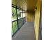 Enjoy the outdoors on this patio with black metal railing and view of nature at 120 Hibiscus Woods Ct # 11B, Deltona, FL 32725