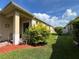 Cozy backyard featuring a lovely patio, healthy green grass, and some foliage at 12728 Boggy Pointe Dr, Orlando, FL 32824