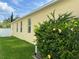 View of home exterior featuring landscaping and greenery at 12728 Boggy Pointe Dr, Orlando, FL 32824