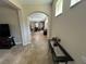 Open entryway with tile flooring, leading to the living and dining areas, creating an inviting flow at 12728 Boggy Pointe Dr, Orlando, FL 32824