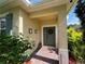 Welcoming front entrance with a brick walkway, a wreath, and decorative elements adding charm at 12728 Boggy Pointe Dr, Orlando, FL 32824