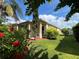 Charming home featuring lush landscaping, colorful flowers and a well-manicured lawn at 12728 Boggy Pointe Dr, Orlando, FL 32824