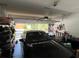 Organized garage featuring a car, ample storage shelving and tools at 12728 Boggy Pointe Dr, Orlando, FL 32824