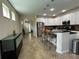 Spacious kitchen and dining area with granite counters and white cabinetry at 12728 Boggy Pointe Dr, Orlando, FL 32824