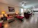 Spacious open concept living area features a comfortable sofa, dining area, and plenty of natural light at 12728 Boggy Pointe Dr, Orlando, FL 32824