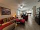 Open-concept living space features a dining area, comfortable sofa, and seamless flow for modern living at 12728 Boggy Pointe Dr, Orlando, FL 32824