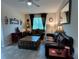 Warm living room featuring stylish furnishings, tile flooring, and a serene ambiance at 12728 Boggy Pointe Dr, Orlando, FL 32824