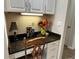 Built-in office nook with granite countertop, storage, and decorative accents at 12728 Boggy Pointe Dr, Orlando, FL 32824